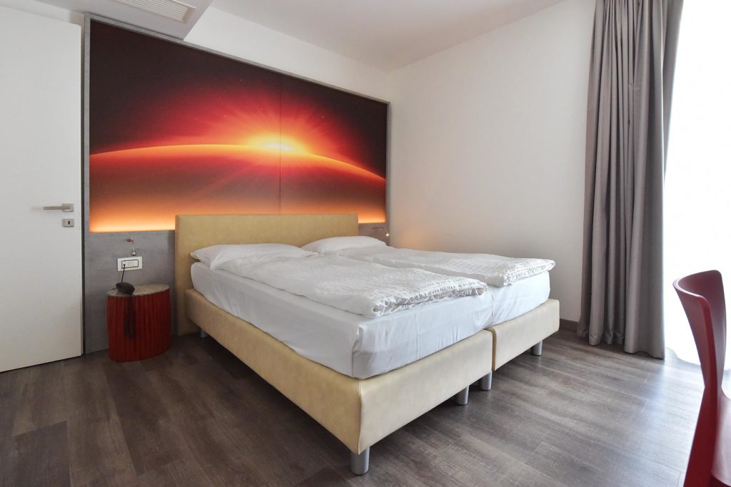 EcoHotel Primavera - Appartamento con due camere Deluxe - Fuoco - camera da letto