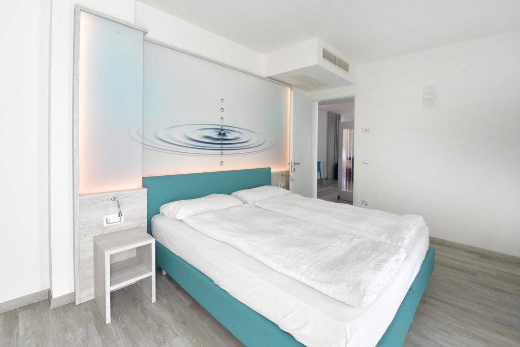 EcoHotel Primavera - Appartamento una camera Deluxe - Acqua - camera da letto